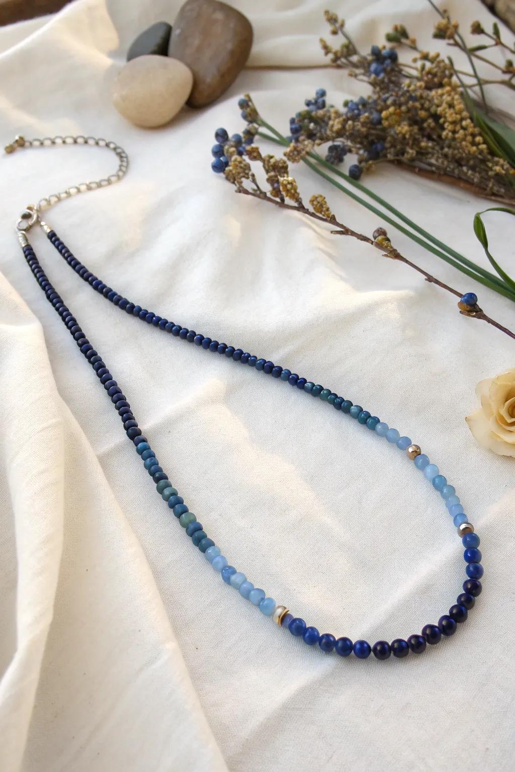 Discover the subtle sophistication of monochrome elegance with this stunning blue seed bead necklace.