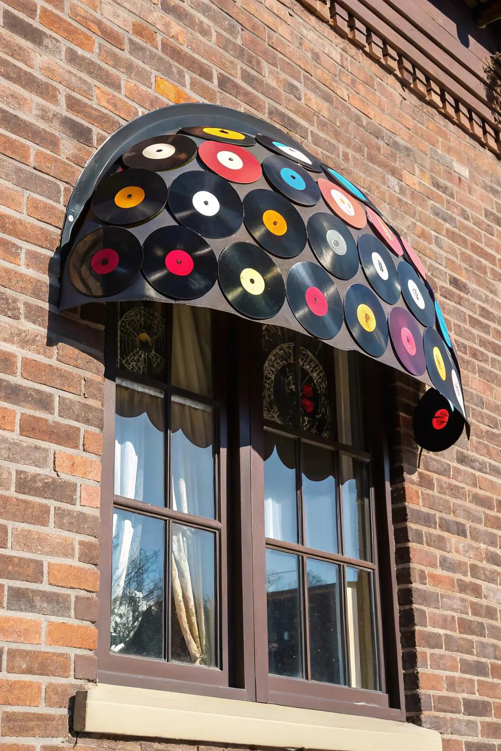 Transform your window with a unique vinyl record awning – where retro meets craftsmanship!