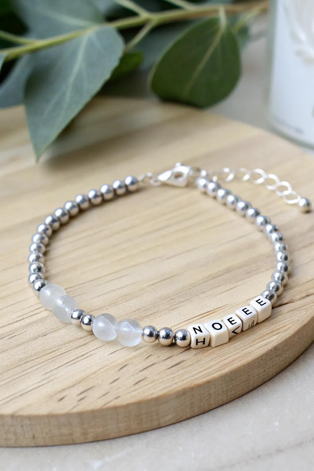 Elegance in simplicity: Discover the beauty of Morse code with a chic mix of silver and glass beads.