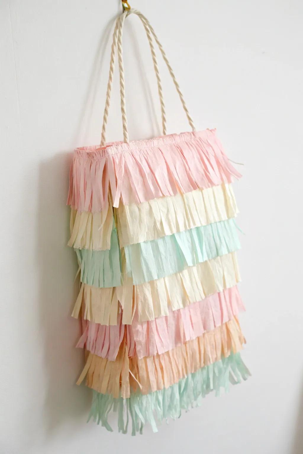 Discover the art of simplicity with a touch of whimsy: Create your own paper bag piñata masterpiece.