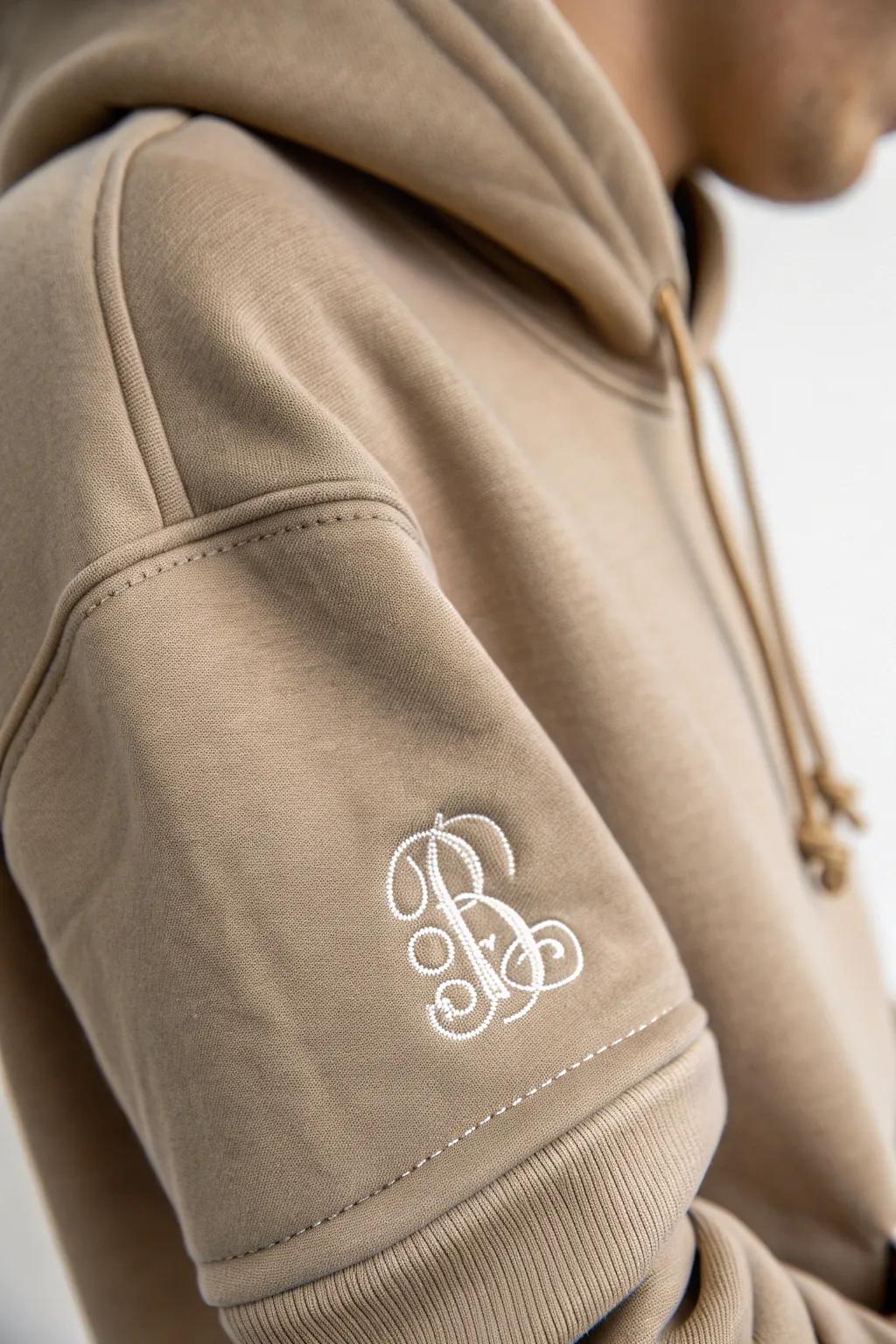 Elevate your style with a touch of elegance: discover the charm of minimalist monograms on custom hoodies.